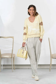 Elisa Cavaletti knitted sweater in white and yellow with a textured pattern, featuring a relaxed fit and long sleeves.