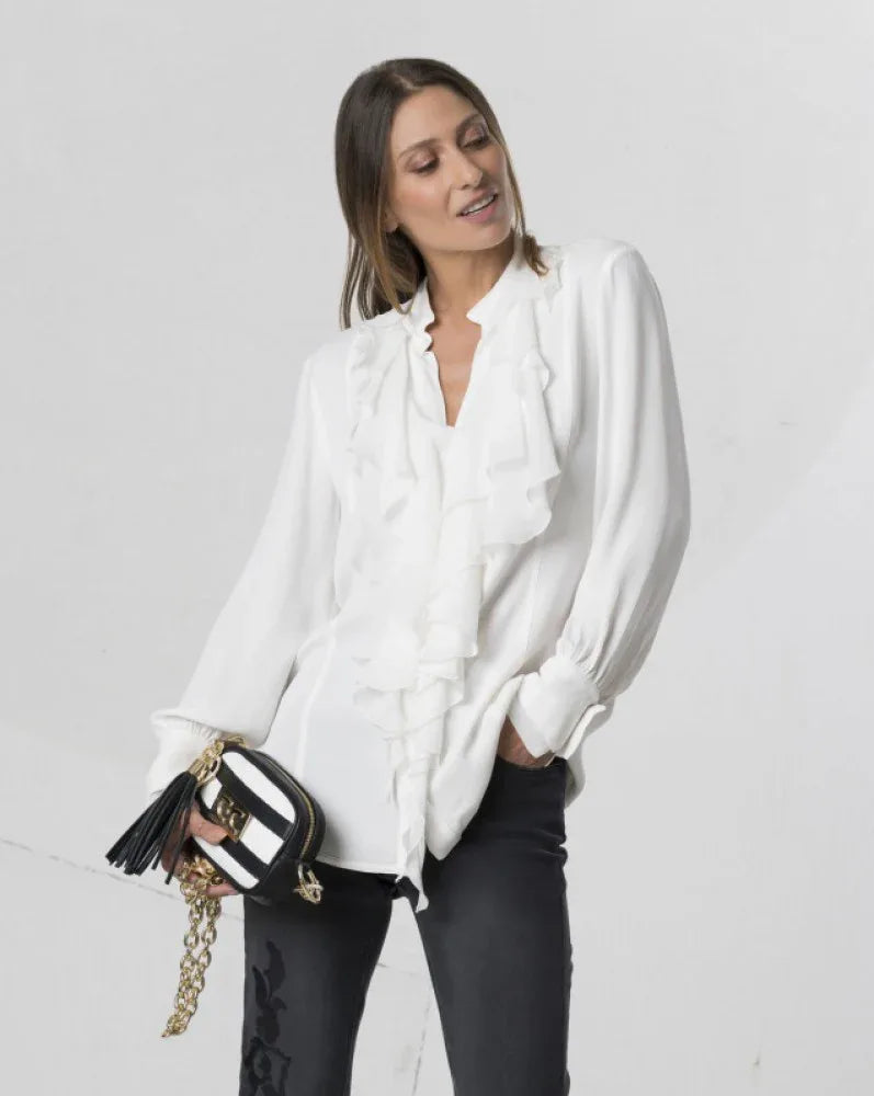 Off white Elisa Cavaletti blouse with ruffles, featuring a feminine design and delicate fabric, displayed on a hanger.
