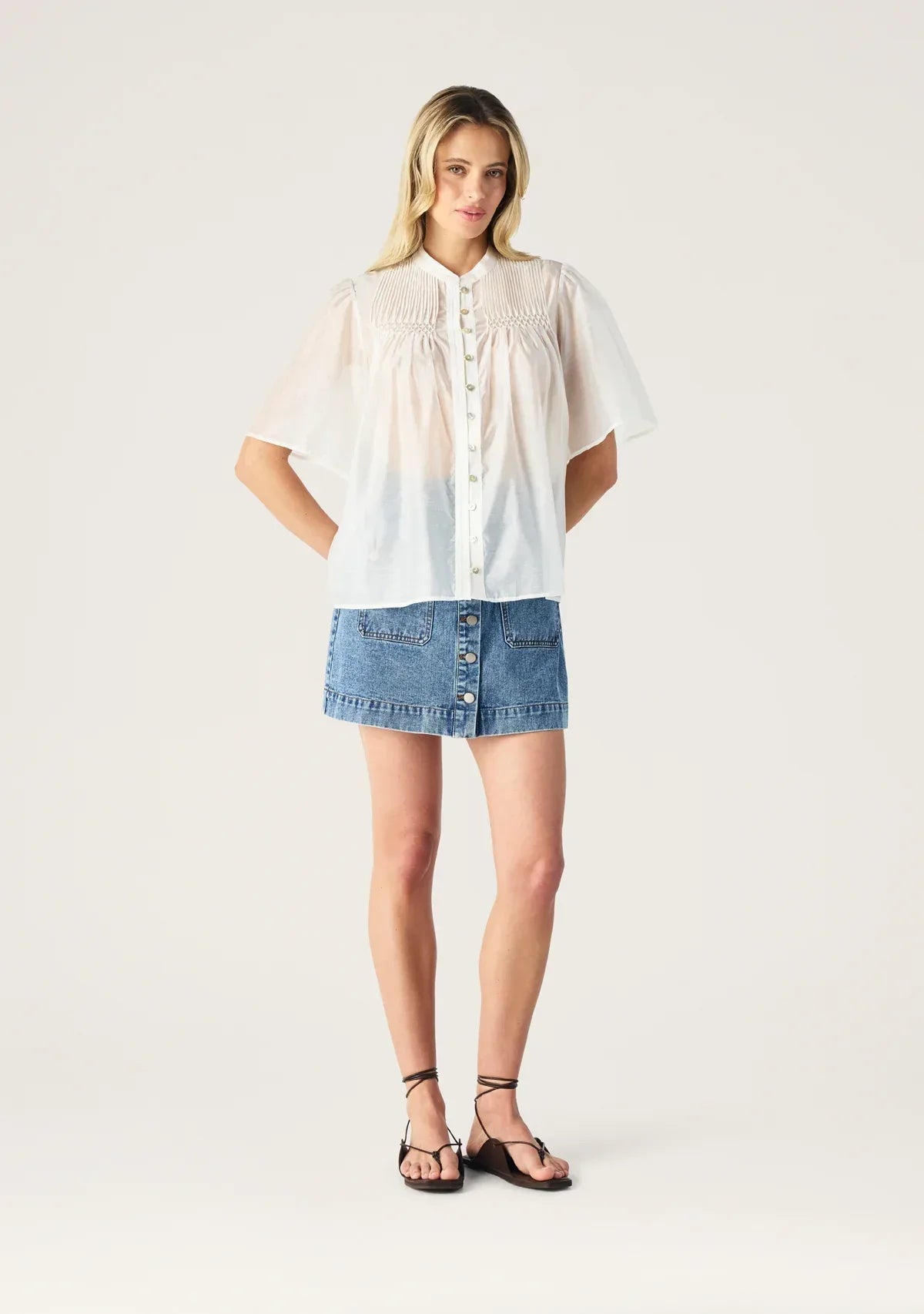 Aveline Denim Skirt by Mos the Label, featuring a fitted design and classic blue denim fabric.