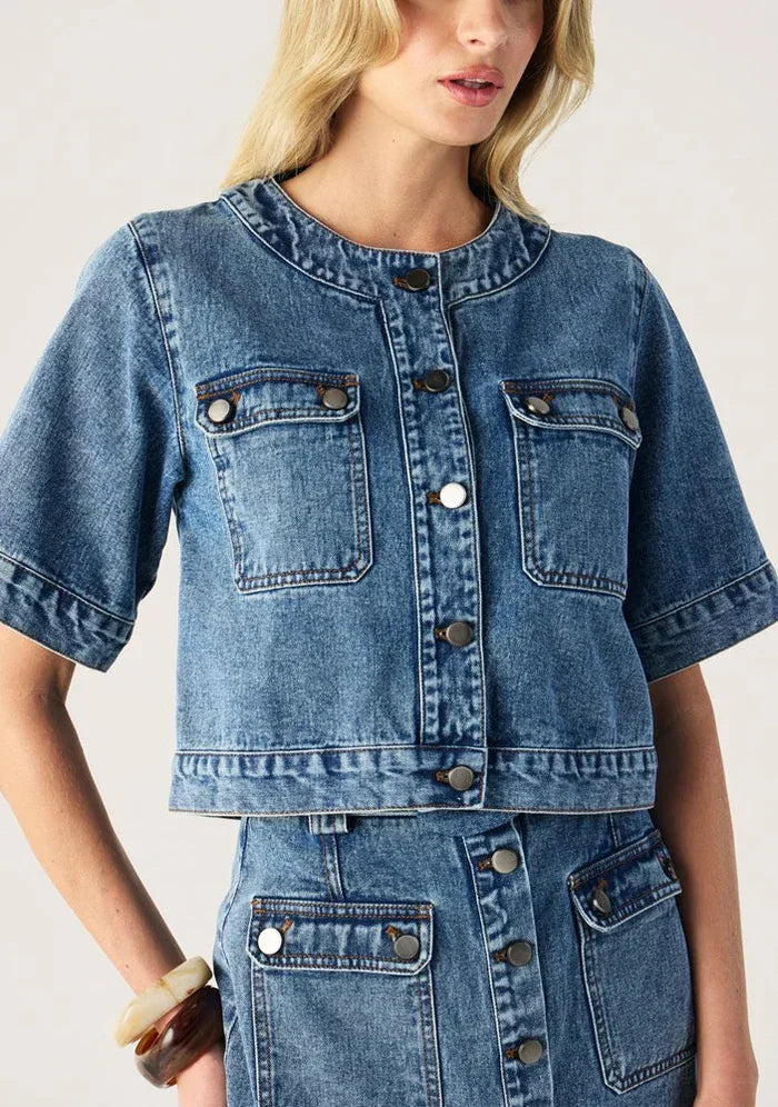 Aveline Denim Top by Mos the Label featuring a stylish design and classic denim fabric in a casual setting.