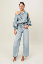 Steel blue Realm Origin Etoile Top featuring a stylish design, shown on a model with a close-up of the fabric and fit.