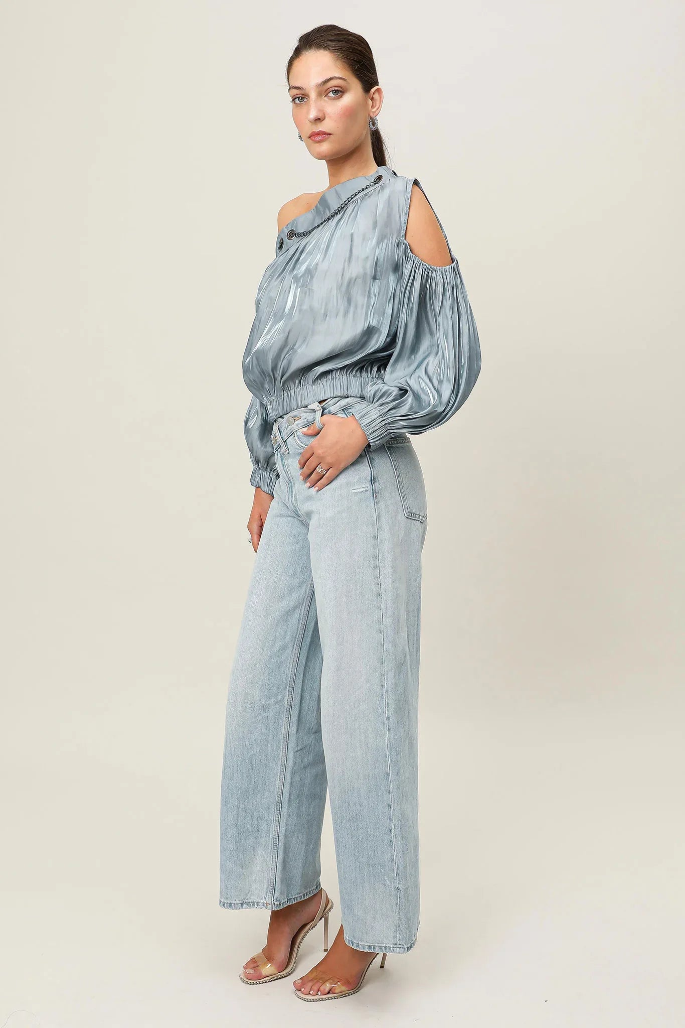 Steel blue Realm Origin Etoile Top with a fitted design and elegant details, shown on a mannequin.