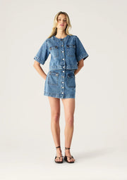Aveline Denim Top by Mos the Label featuring a fitted design and classic blue denim fabric.