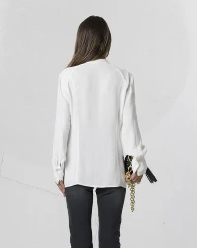 Off white Elisa Cavaletti ruffle blouse with delicate, flowing fabric and detailed ruffle accents visible in the image.