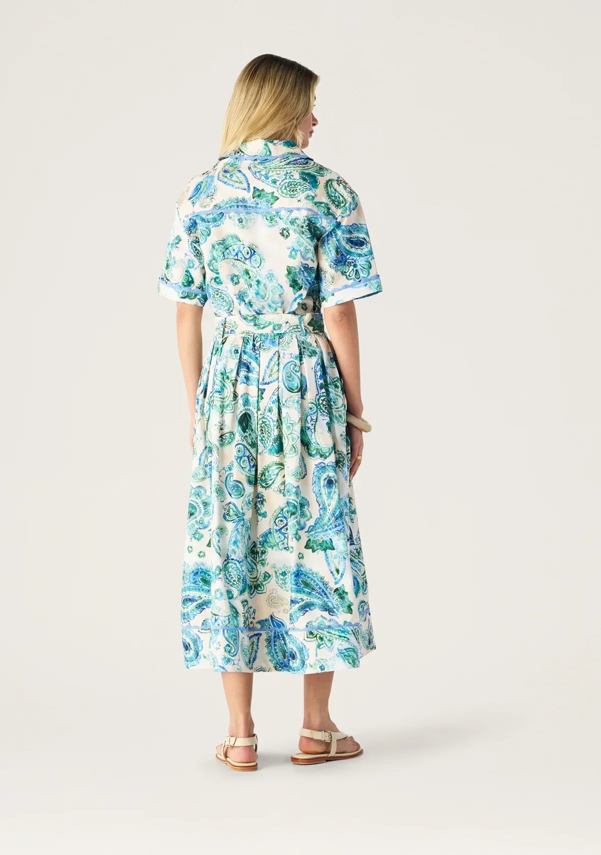 Mos the Label Opaline Midi Skirt in flowy fabric with a pastel color, showcasing a stylish, elegant design.