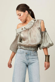 Realm Origin Etoile Top in metallic bronze, close-up of stylish, shiny fabric with a sleek, modern design.