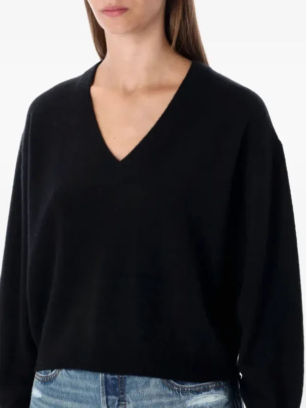 Black American Vintage Raxow 18 V-neck sweater displayed on a mannequin, showcasing its classic style and comfortable fit.