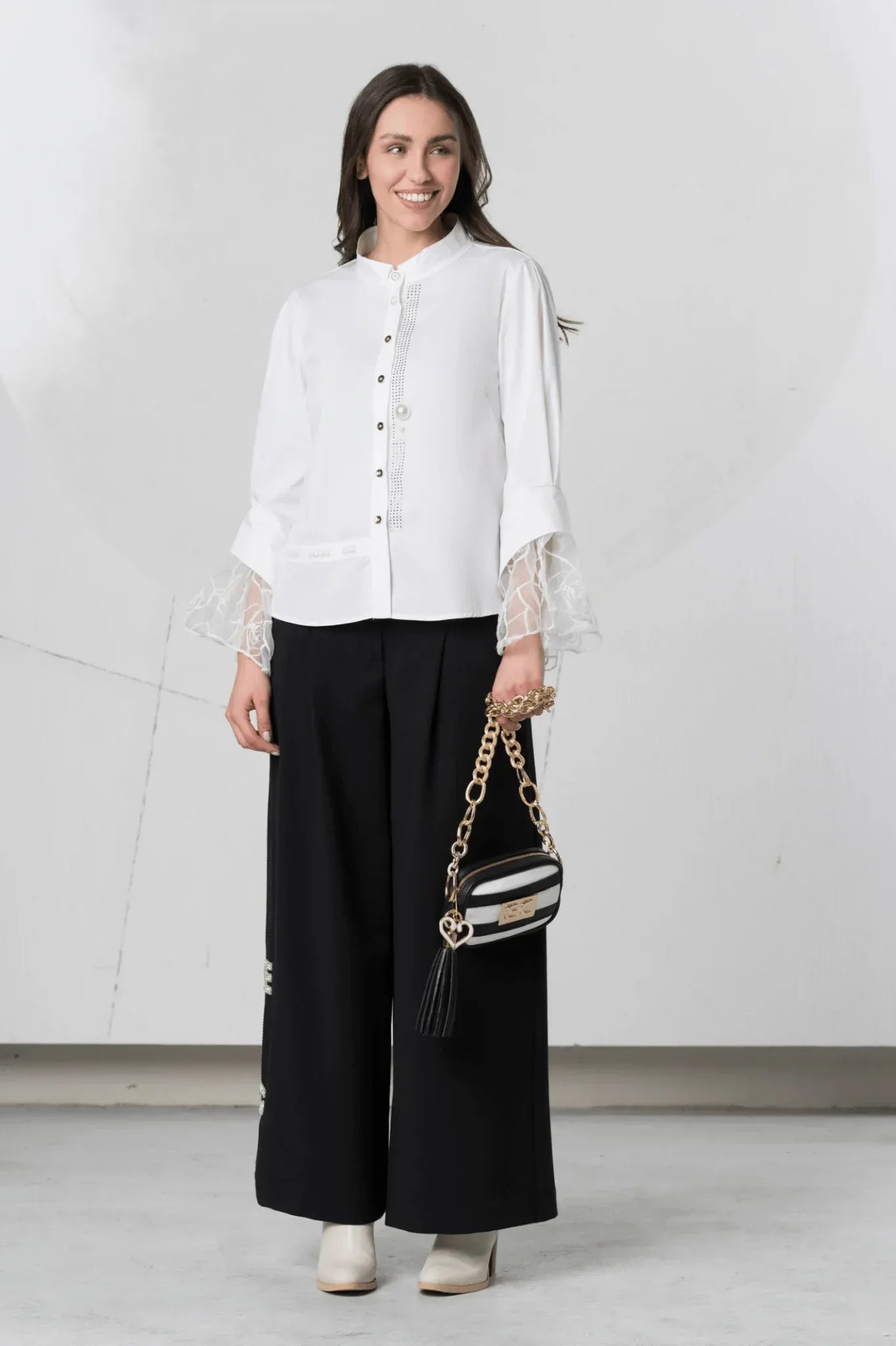 White Elisa Cavaletti blouse with lace cuff details, featuring a stylish and elegant design.