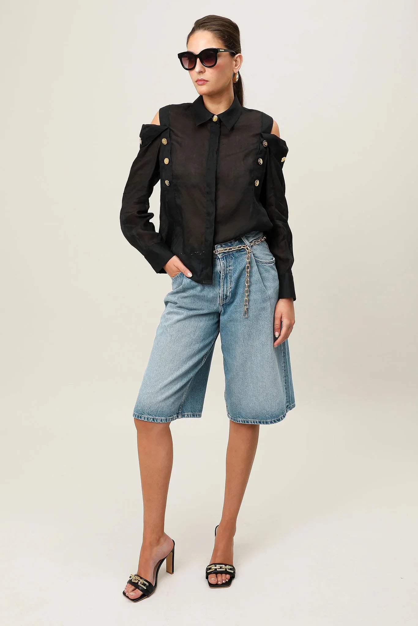 Black Realm Origin Vivre Shirt laid flat, showing its sleek design and soft fabric details.