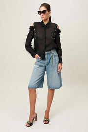 Black Realm Origin Vivre Shirt laid flat, showing its sleek design and soft fabric details.