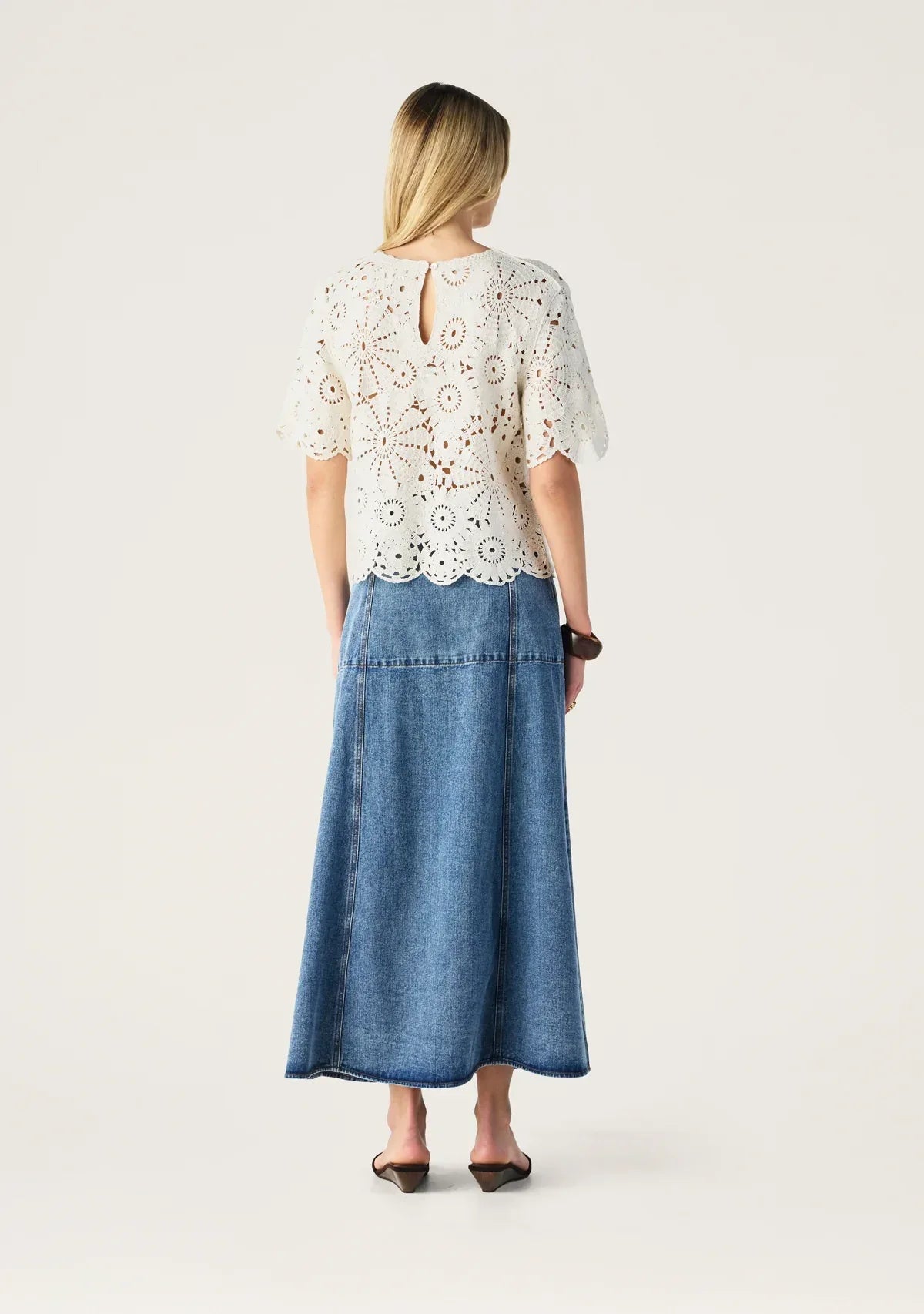 Aveline denim midi skirt by Mos the Label, featuring a classic cut and a medium wash for a versatile look.