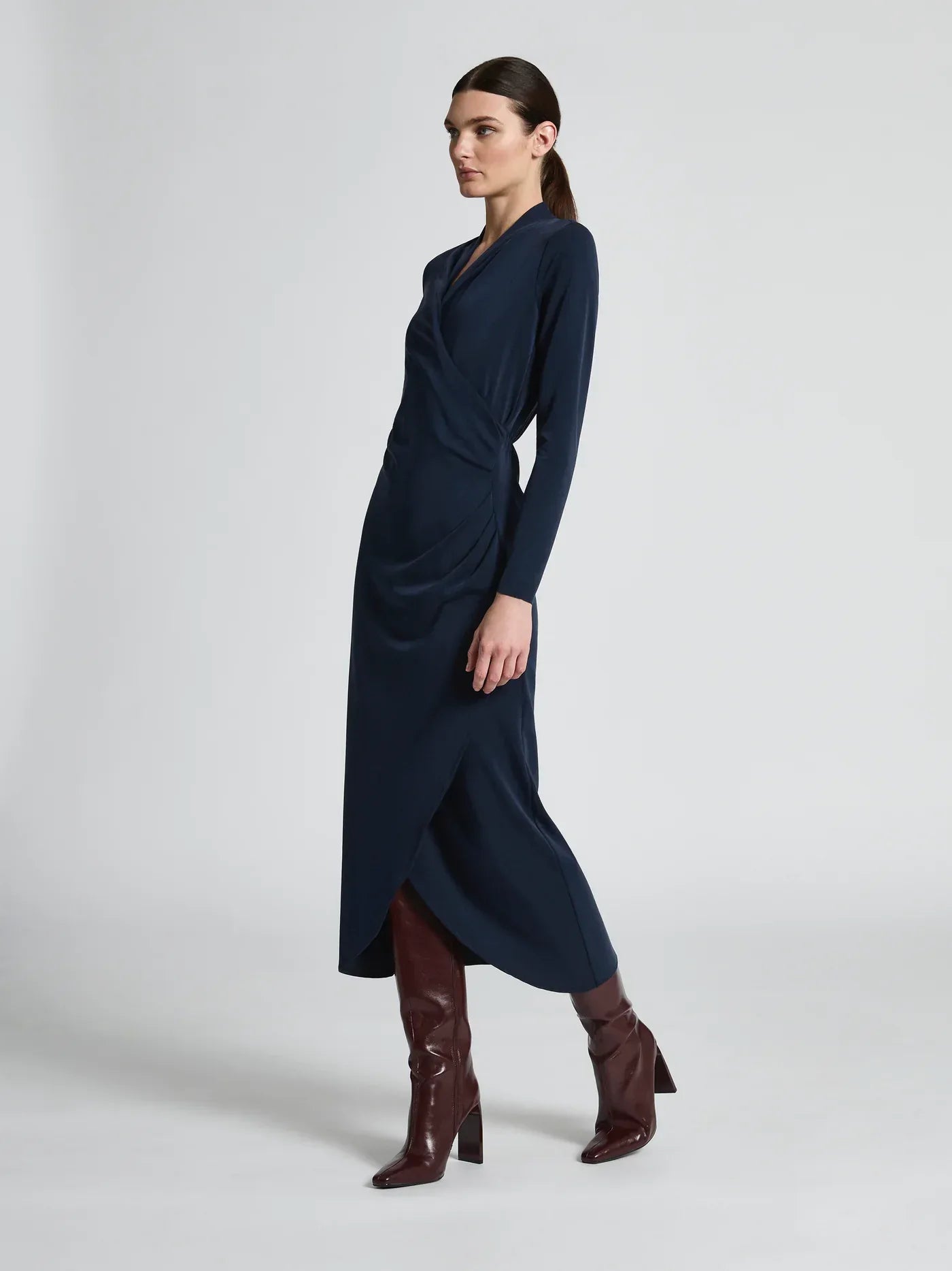 Navy Jemma Dress by Moss and Spy featuring a stylish, fitted silhouette and elegant design, displayed on a hanger.