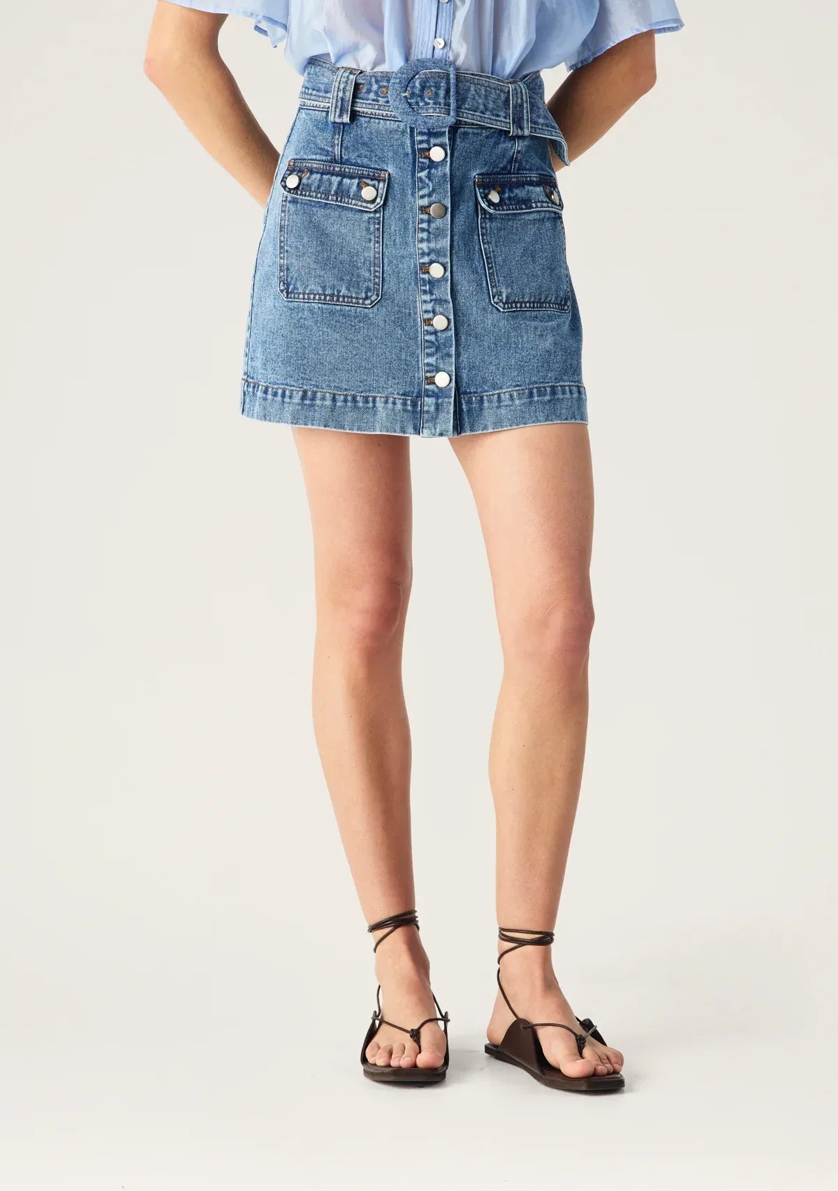 Aveline Denim Skirt by Mos the Label, featuring a classic design in a light blue wash with a mid-length cut.